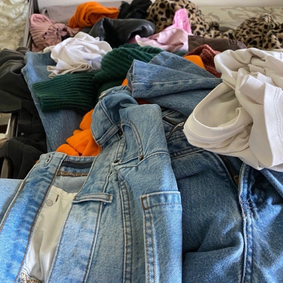 Donation Box – A box filled with clothes, books, and household items ready for donation as part of a decluttering routine.